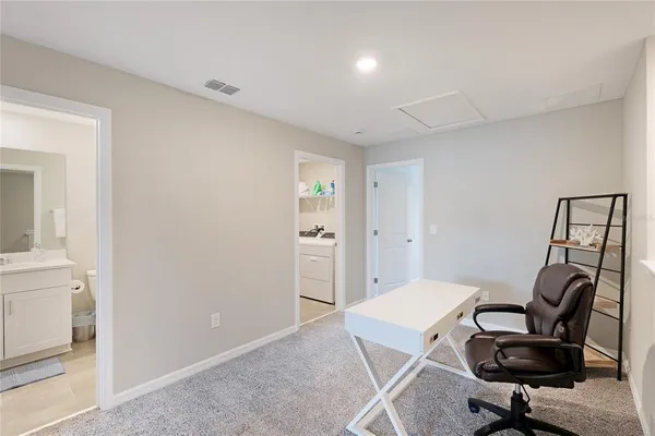 a workspace with furniture and bedroom view