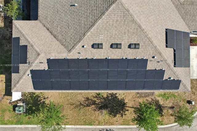an aerial view of a house with outdoor space