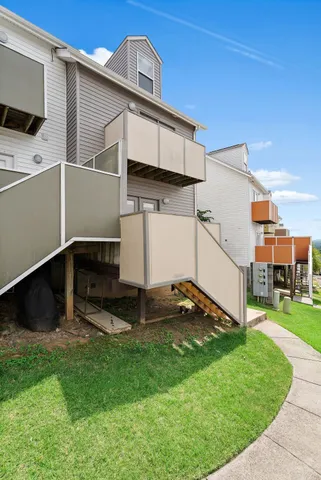 a view of a patio with a yard