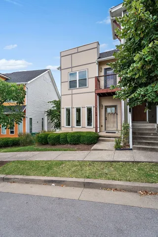 front view of a house and a small yard