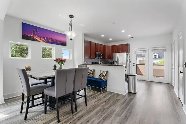 a view of a dining room with furniture window and wooden floor