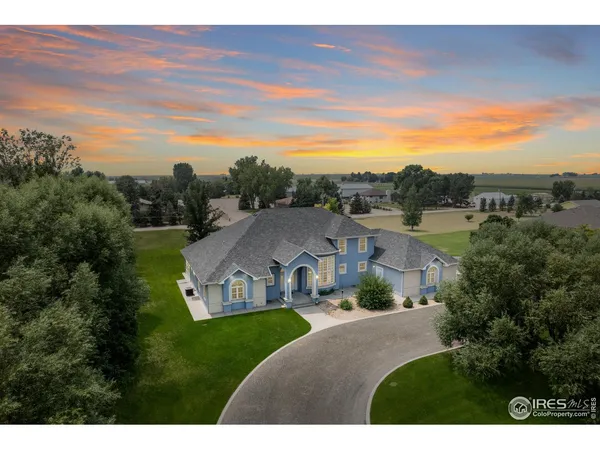 a view of a house with a big yard