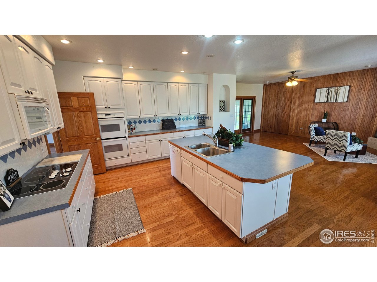 17606 County Road Q Fort Morgan, CO 80701 - Photo 19 of 37 a kitchen with stainless steel appliances granite countertop a sink stove and refrigerator
