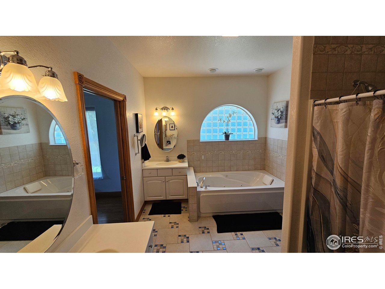 17606 County Road Q Fort Morgan, CO 80701 - Photo 7 of 37 a bathroom with a sink a toilet and a mirror