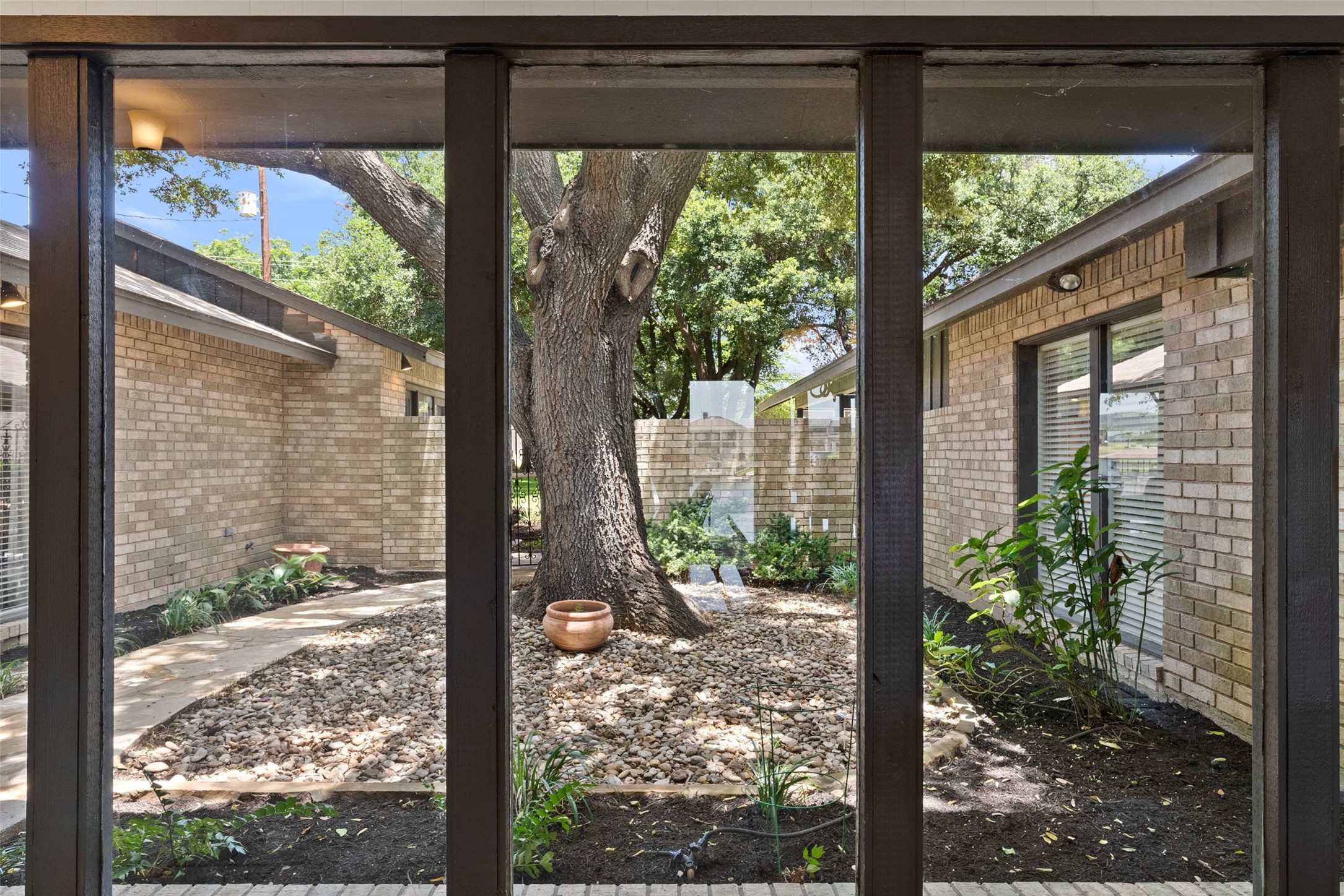 141 Perry Lane Kingsland, TX 78639 - Photo 20 of 40 An inviting courtyard garden creates a natural focal point visible from within.