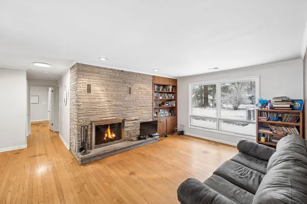 a view of a livingroom with furniture and a fireplace