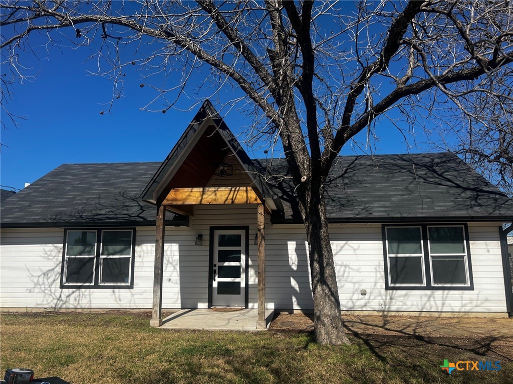 1005 Bridge Street Lampasas, TX 76550 - Photo 1 of 29 a front view of a house with garden