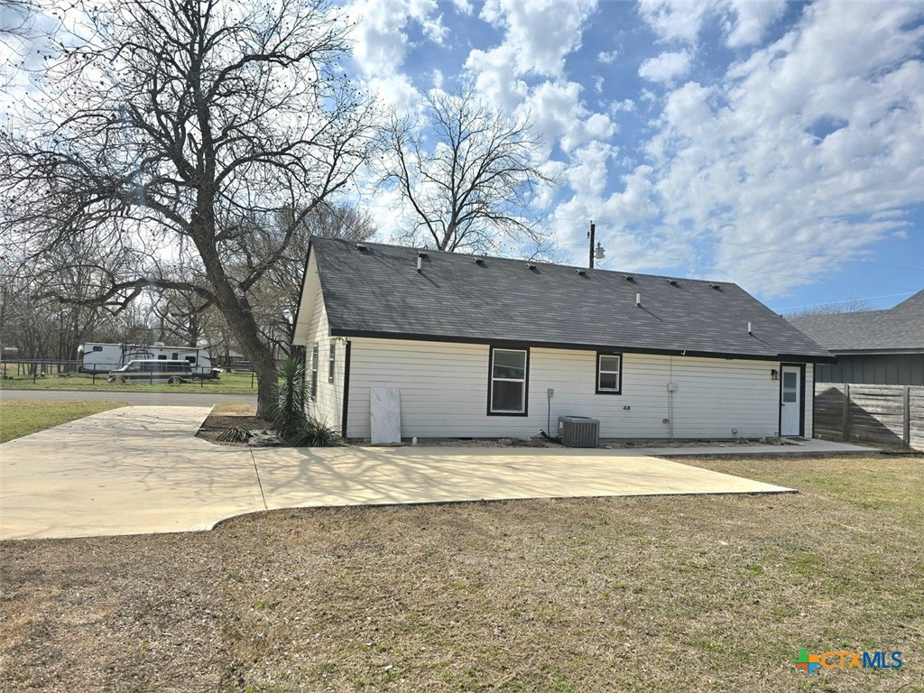 1005 Bridge Street Lampasas, TX 76550 - Photo 3 of 29 a house that has a tree in front of it
