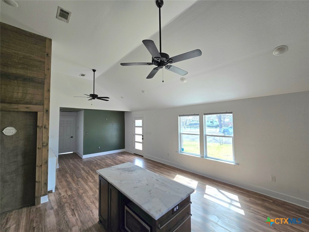1005 Bridge Street Lampasas, TX 76550 - Photo 8 of 29 a view of a kitchen with a sink a ceiling fan and kitchen view