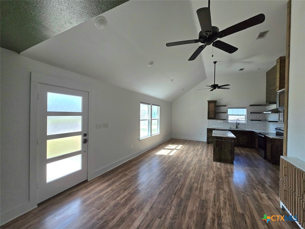 1005 Bridge Street Lampasas, TX 76550 - Photo 10 of 29 a kitchen view with a counter space a sink and appliances
