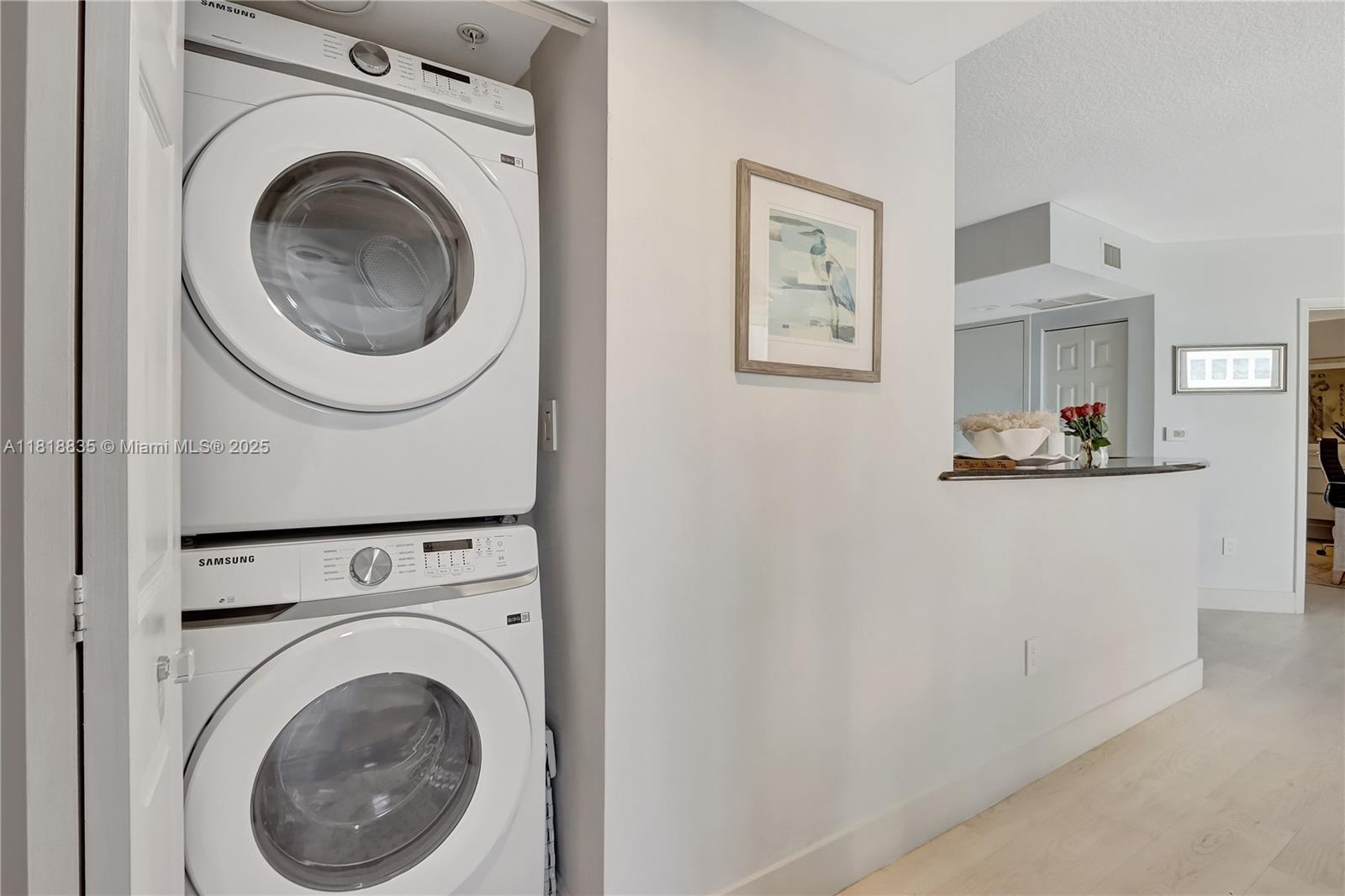 3232 Southwest 22nd Terrace, Unit 404 Miami, FL 33145 - Photo 15 of 21 a close up view of a washer and dryer