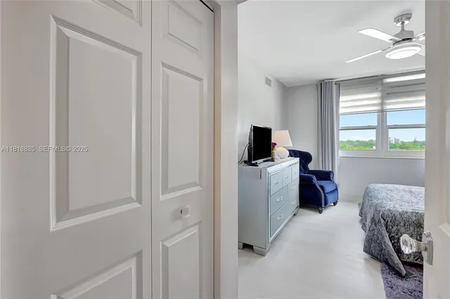 a view of bedroom with workspace and window
