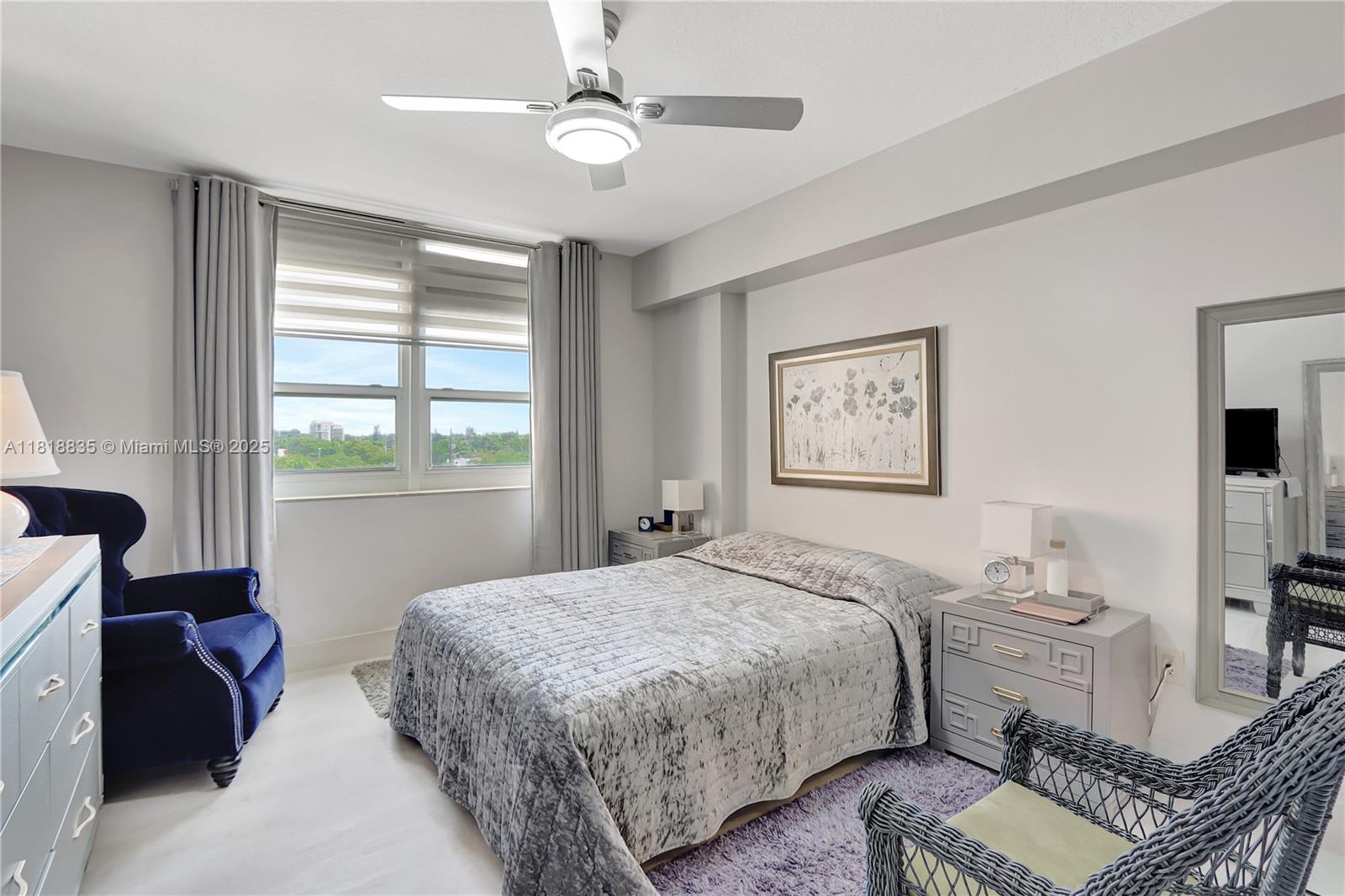 3232 Southwest 22nd Terrace, Unit 404 Miami, FL 33145 - Photo 17 of 21 a bedroom with a bed furniture and a window