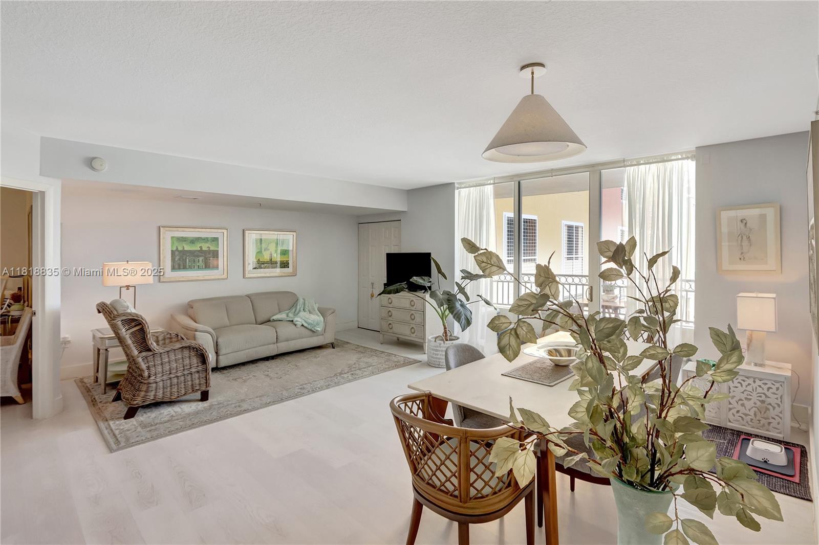 3232 Southwest 22nd Terrace, Unit 404 Miami, FL 33145 - Photo 10 of 21 a living room with furniture and a large window