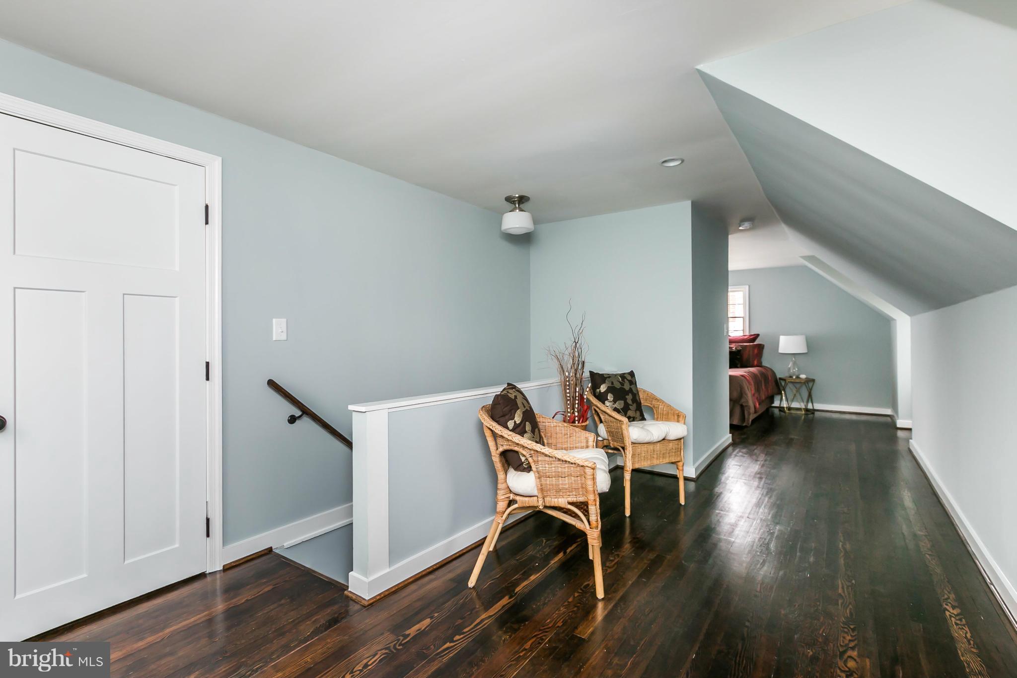 5504 Catalpha Road Baltimore, MD 21214 - Photo 12 of 28 a view of a room with wooden floor lounge chair and windows
