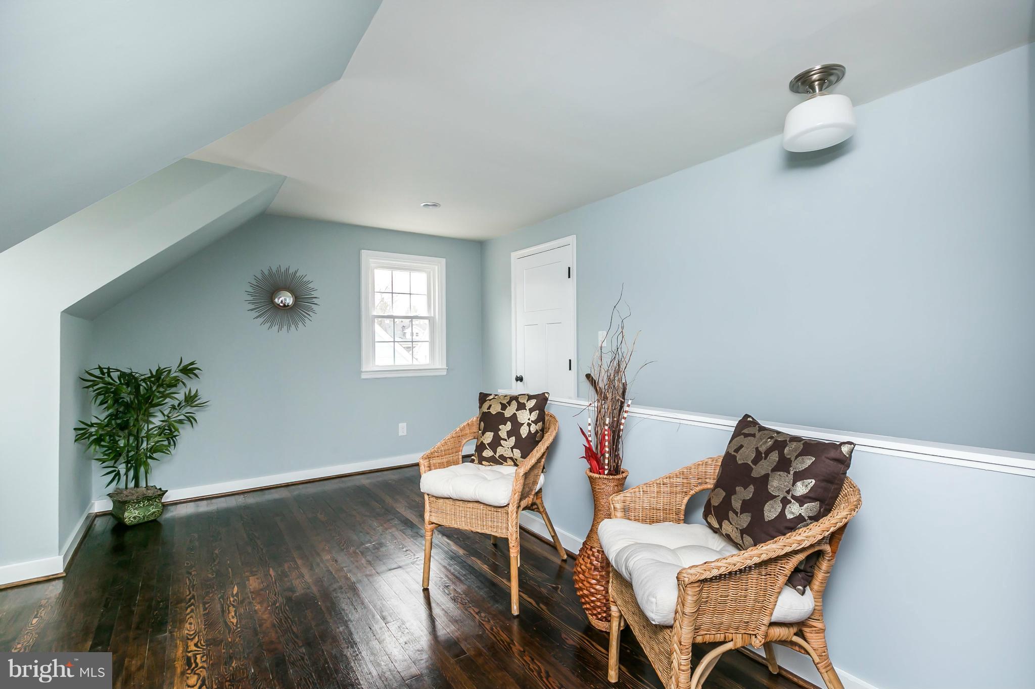 5504 Catalpha Road Baltimore, MD 21214 - Photo 13 of 28 a view of a dining room with furniture and wooden floor