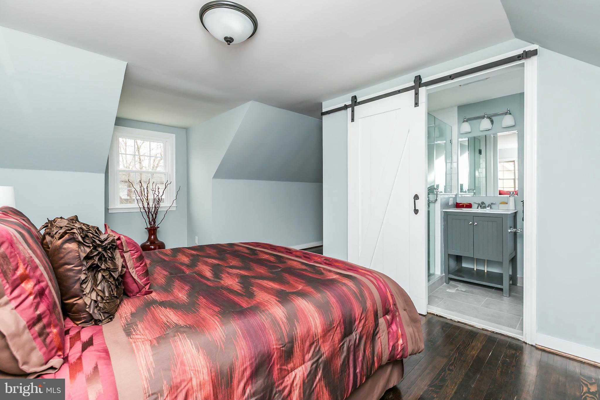 5504 Catalpha Road Baltimore, MD 21214 - Photo 15 of 28 a bedroom with a bed and a window