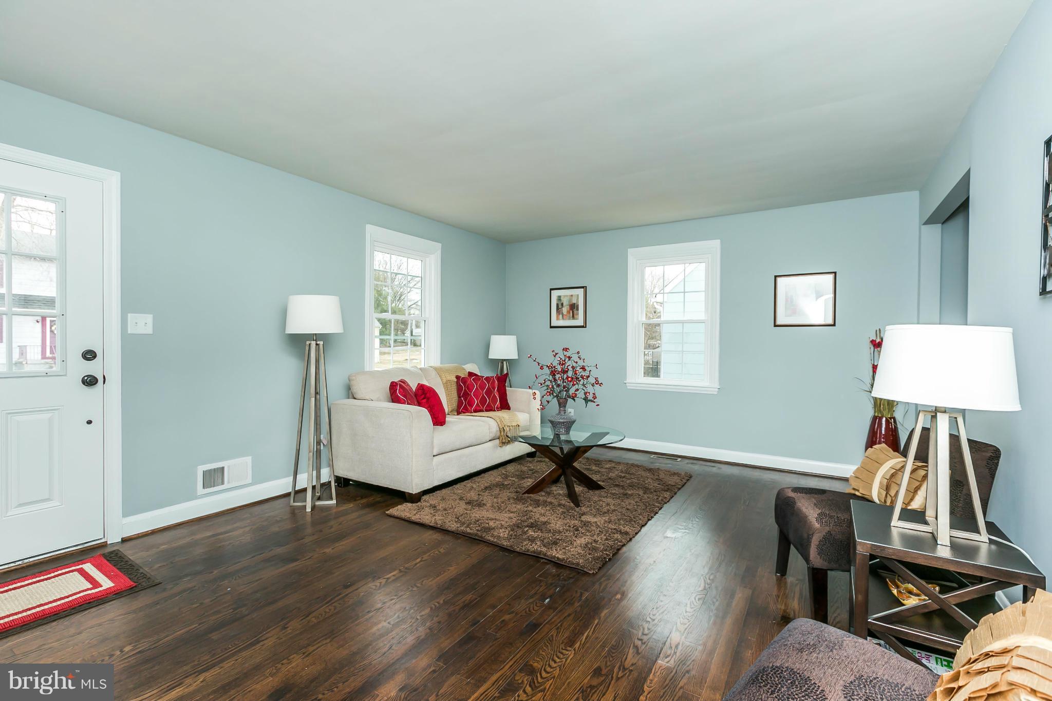 5504 Catalpha Road Baltimore, MD 21214 - Photo 3 of 28 a living room with furniture and a wooden floor
