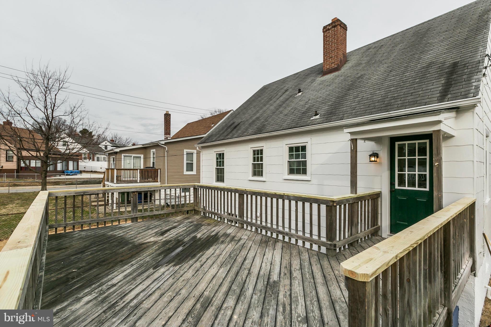 5504 Catalpha Road Baltimore, MD 21214 - Photo 28 of 28 a view of a house with wooden deck