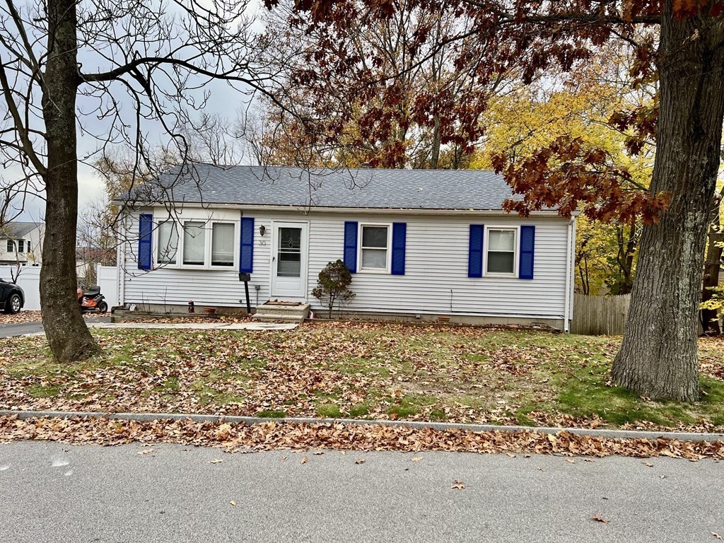 front view of a house with a yard
