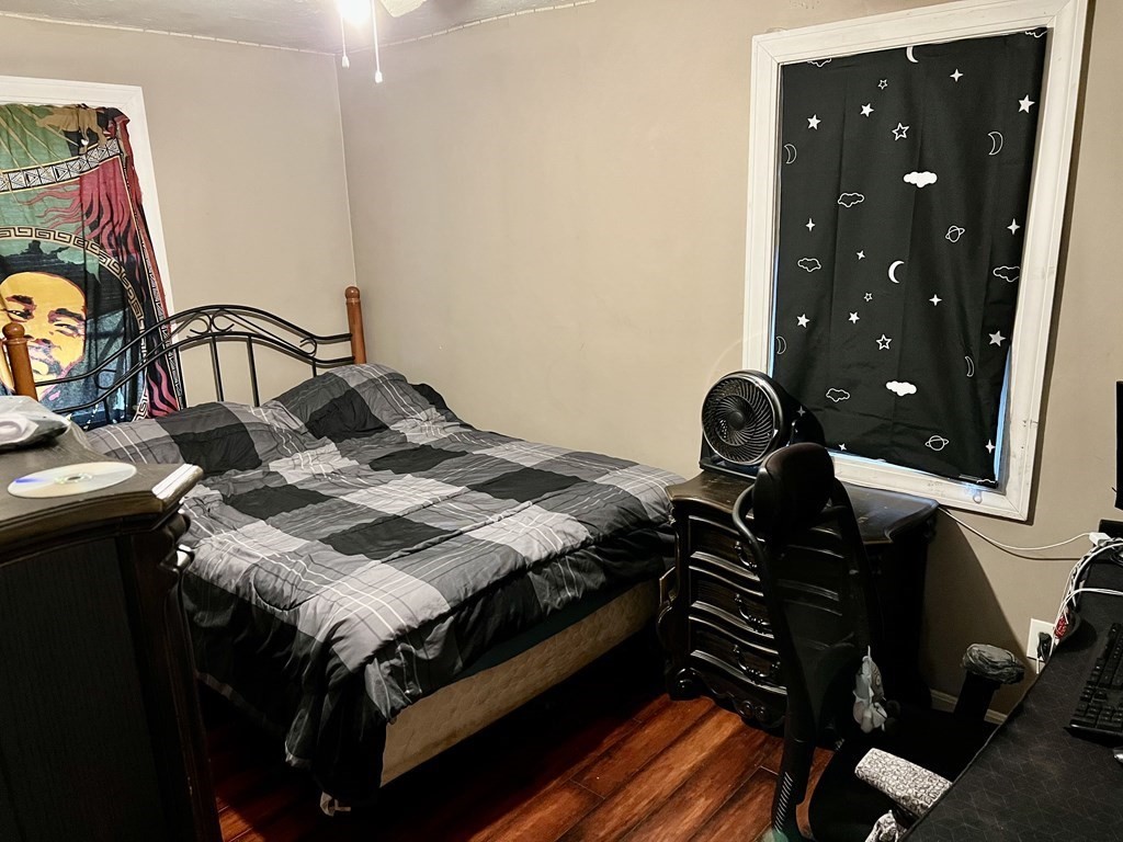 30 Tennyson Street Worcester, MA 01610 - Photo 12 of 19 a bed sitting in a bedroom next to a window