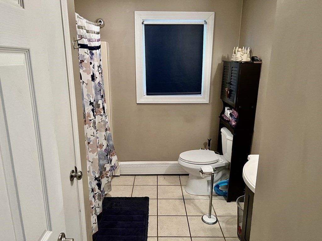 30 Tennyson Street Worcester, MA 01610 - Photo 9 of 19 a bathroom with a toilet and a shower