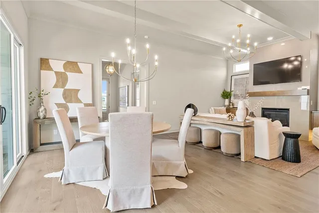 a living room with patio furniture and a flat screen tv