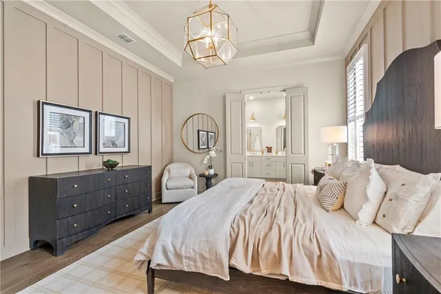 a bedroom with a bed and a dresser