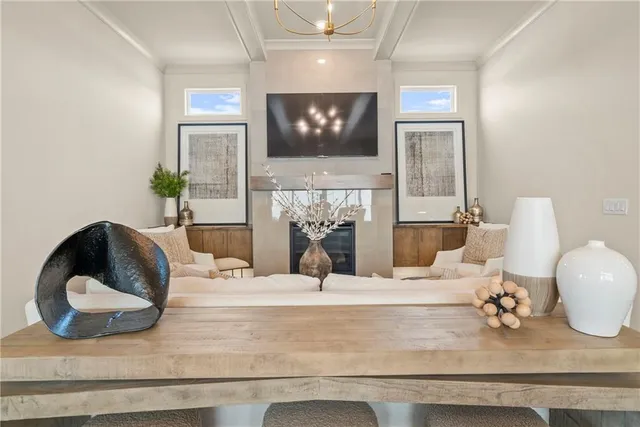 a room with a large mirror and a chandelier