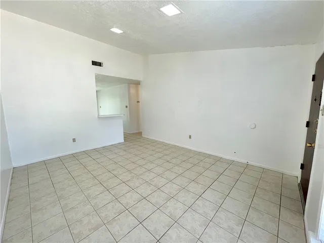 an empty room with a bench