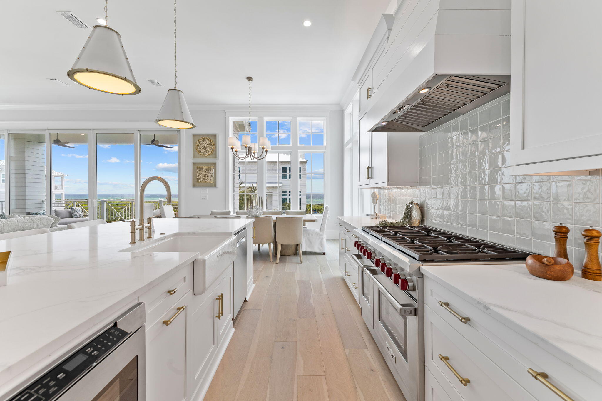 55 Pompano Street Inlet Beach, FL 32461 - Photo 12 of 122 a kitchen with stainless steel appliances a sink a stove and a wooden floors