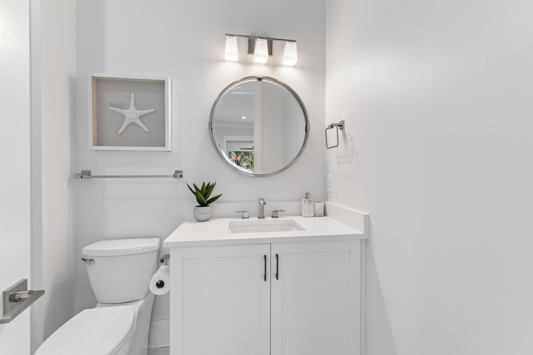 55 Pompano Street Inlet Beach, FL 32461 - Photo 41 of 122 a bathroom with a toilet a sink and a mirror