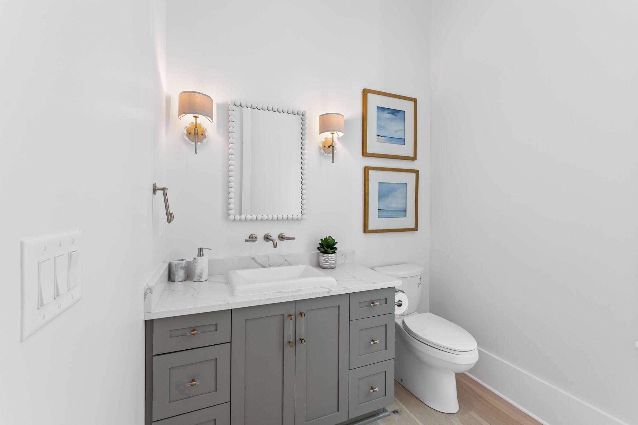 55 Pompano Street Inlet Beach, FL 32461 - Photo 54 of 122 a bathroom with a toilet sink vanity and mirror