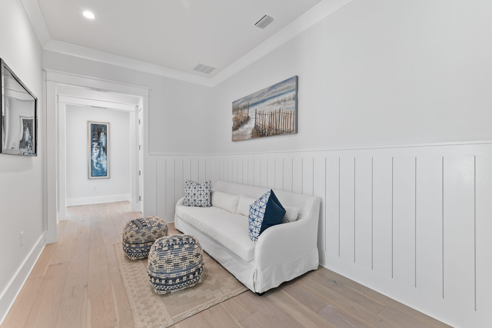 55 Pompano Street Inlet Beach, FL 32461 - Photo 61 of 122 a living room with furniture and a painting on the wall
