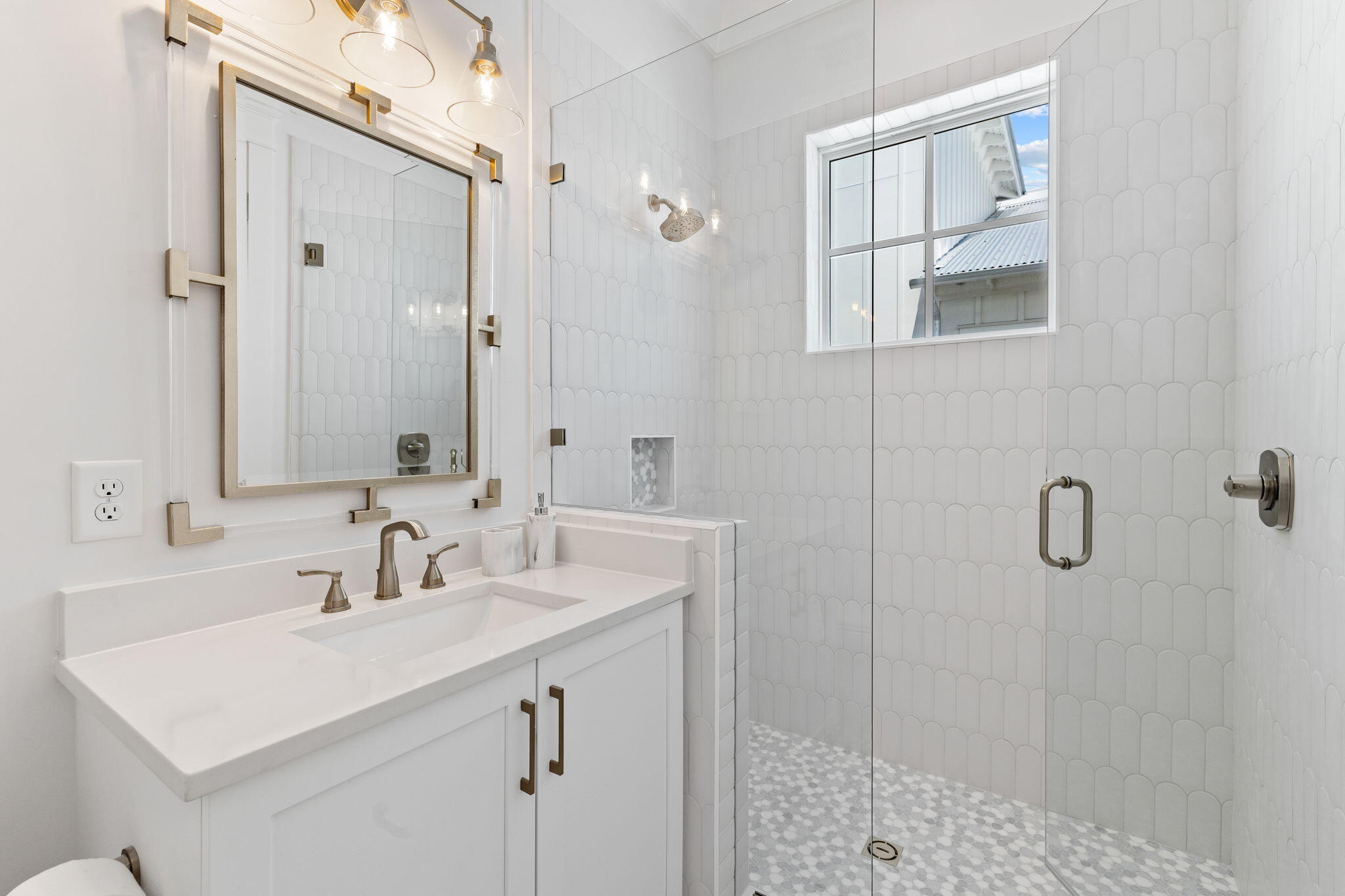 55 Pompano Street Inlet Beach, FL 32461 - Photo 65 of 122 a bathroom with a sink a mirror and shower