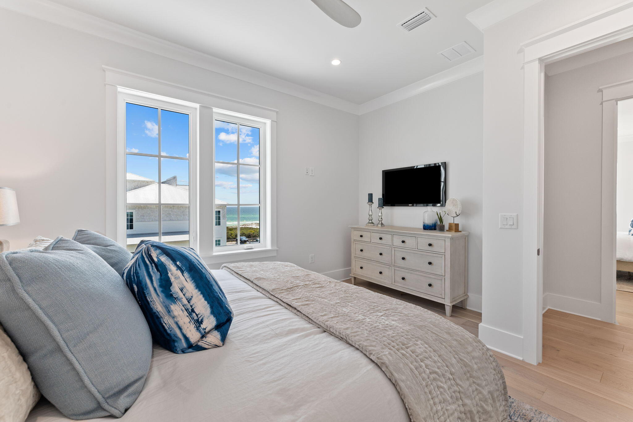 55 Pompano Street Inlet Beach, FL 32461 - Photo 73 of 122 a spacious bedroom with a bed and flat screen tv
