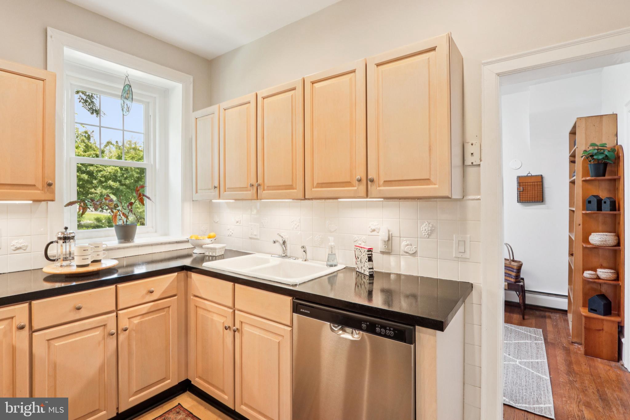 1523 Susquehanna Road Rydal, PA 19046 - Photo 27 of 69 a kitchen with stainless steel appliances granite countertop a sink and a white cabinets
