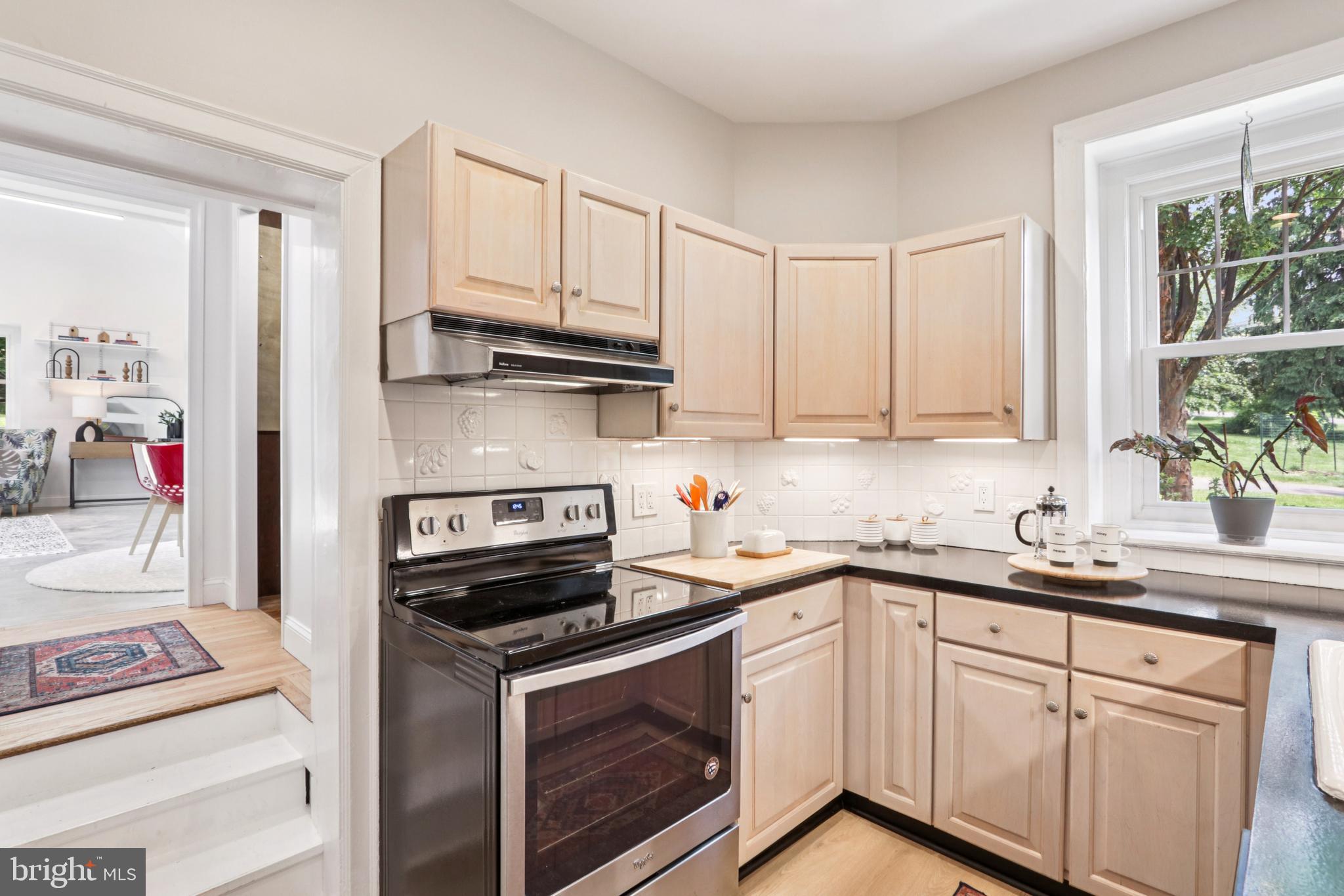 1523 Susquehanna Road Rydal, PA 19046 - Photo 28 of 69 a kitchen with stainless steel appliances granite countertop a sink stove oven and white cabinets