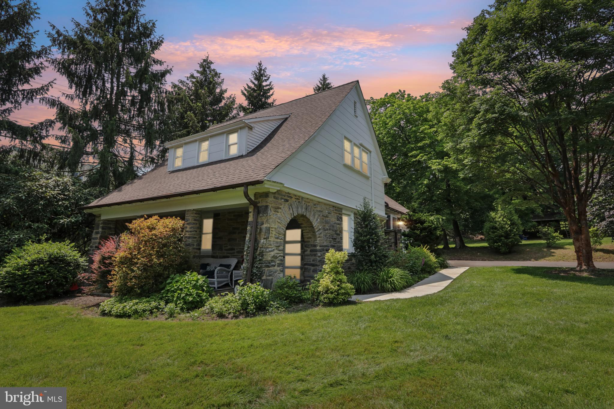 1523 Susquehanna Road Rydal, PA 19046 - Photo 53 of 69 a front view of house with a garden