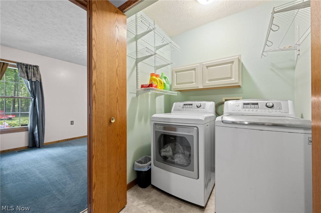 5100 McCormick Road Ravenna, OH 44266 - Photo 21 of 34 1st floor laundry, washer and dryer come with the home.