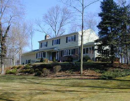 192 Dundee Road Stamford, CT 06903 - Photo 1 of 1 a front view of a house with a garden