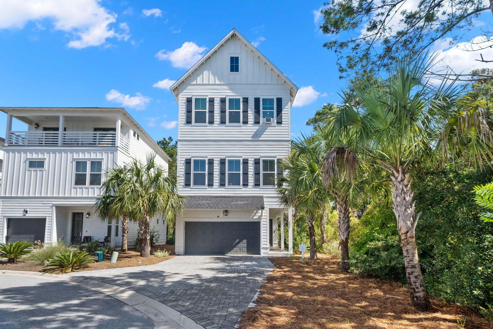 178 Valdare Ln Inlet Beach Inlet Beach, FL 32461 - Photo 19 of 58 a front view of a house with a yard