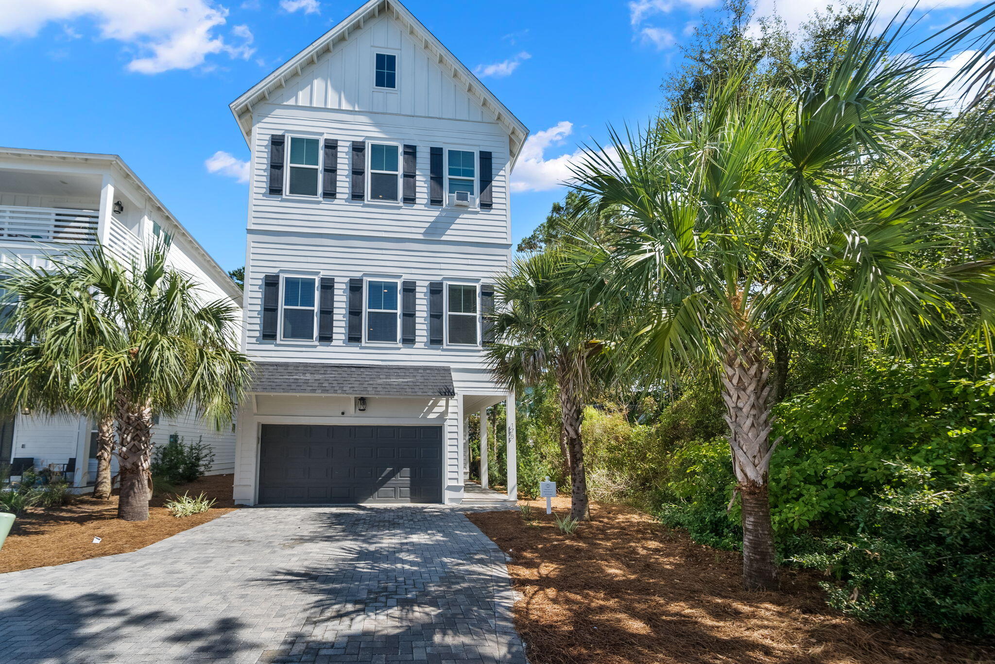 178 Valdare Ln Inlet Beach Inlet Beach, FL 32461 - Photo 9 of 58 a front view of a house with a yard