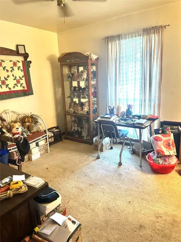 a reading room with furniture and a window