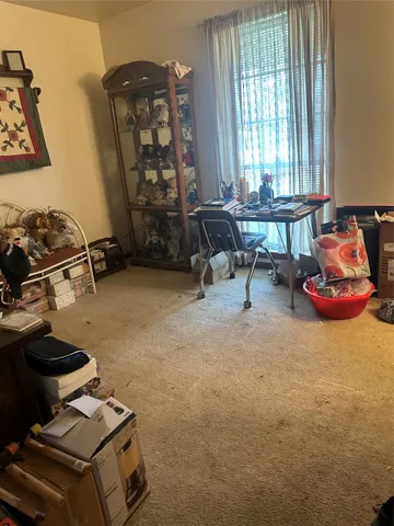 a room with gym equipment and a large window