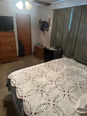 a bed in a bedroom and a mirror