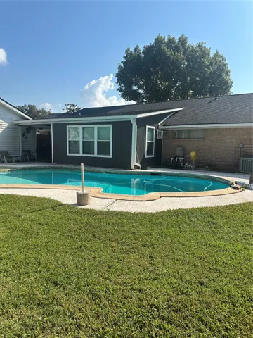 a view of a house with a swimming pool