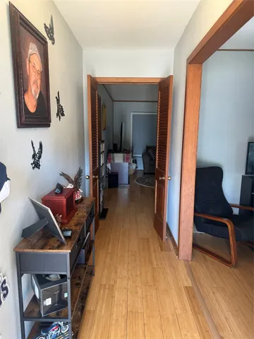 a view of a hardwood floor and dining room