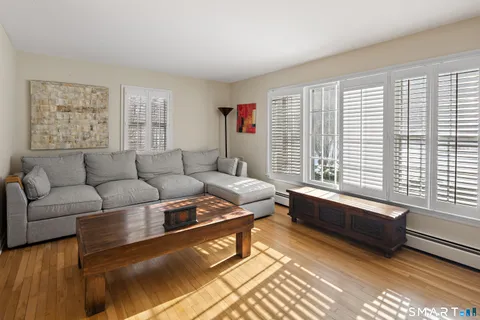 a living room with furniture and a window