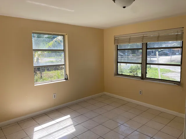 a view of an empty room with a window